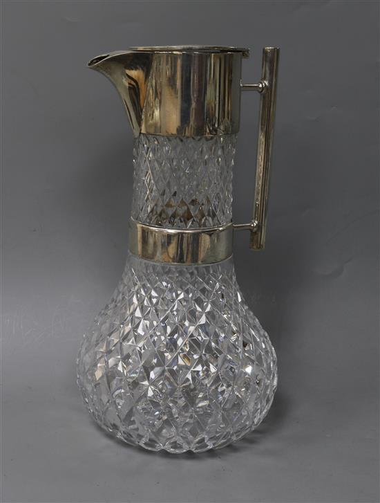 A late Victorian silver mounted cut glass claret jug by Hukin & Heath, in the manner of Christopher Dresser, 26cm.